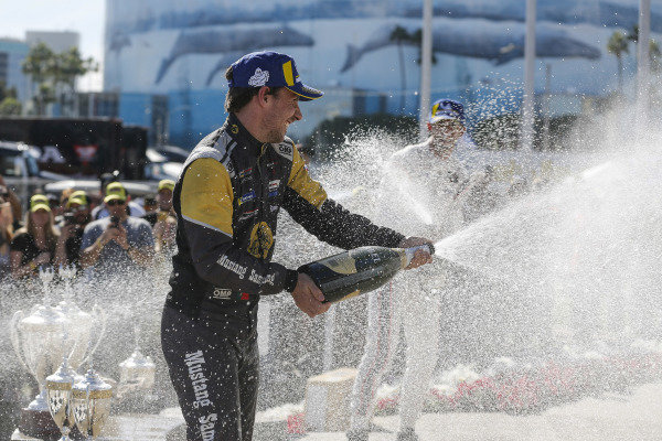 #5 Mustang Sampling Racing Cadillac DPi, DPi: Joao Barbosa, Filipe Albuquerque, #6 Acura Team Penske Acura DPi, DPi: Juan Pablo Montoya, Dane Cameron, #7 Acura Team Penske Acura DPi, DPi: Helio Castroneves, Ricky Taylor celebrate on the podium with champagne #5 Mustang Sampling Racing Cadillac DPi, DPi: Joao Barbosa, Filipe Albuquerque, #6 Acura Team Penske Acura DPi, DPi: Juan Pablo Montoya, Dane Cameron, #7 Acura Team Penske Acura DPi, DPi: Helio Castroneves, Ricky Taylor celebrate on the podium with champagne