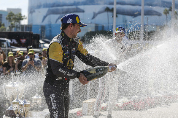 #5 Mustang Sampling Racing Cadillac DPi, DPi: Joao Barbosa, Filipe Albuquerque, #6 Acura Team Penske Acura DPi, DPi: Juan Pablo Montoya, Dane Cameron, #7 Acura Team Penske Acura DPi, DPi: Helio Castroneves, Ricky Taylor celebrate on the podium with champagne