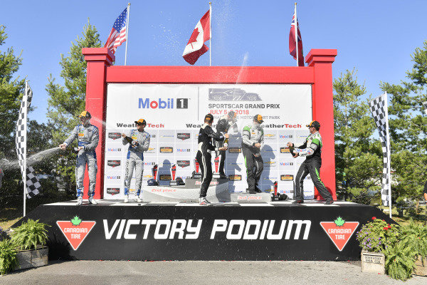 #33 Riley Motorsports Mercedes AMG GT3, GTD: Jeroen Bleekemolen, Ben Keating celebrates the win in Victory Lane on the podium with #14 3GT Racing Lexus RCF GT3, GTD: Dominik Baumann, Kyle Marcelli, #44 Magnus Racing Audi R8 LMS GT3, GTD: John Potter, Andy Lally