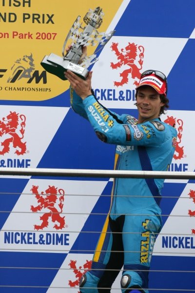 2007 Moto GP British Grand Prix.
Donington Park, England.
22nd-24th June 2007.
Chris Vermeulen (Rizla Suzuki Moto GP, Suzuki GSV-R XRG0) celebrates 3rd position on the podium, portrait.
World Copyright: Kevin Wood/LAT Photographic
ref: Digital Image IMG_6405