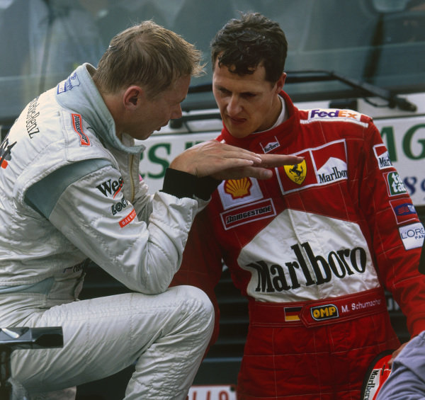 Spa-Francorchamps, Belgium. 25-27 August 2000.
Mika Hakkinen (McLaren MP4/15 Mercedes), 1st position, and Michael Schumacher (Ferrari F1-2000), 2nd position, discuss their battle, which eventually led to Hakkinen passing Schumacher for the lead while lapping Ricardo Zonta on the Kemmel straight.
World Copyright- Steve Tee/LAT Photographic.Ref: Colour Transparency. Spa-Francorchamps, Belgium. 25-27 August 2000.
Mika Hakkinen (McLaren MP4/15 Mercedes), 1st position, and Michael Schumacher (Ferrari F1-2000), 2nd position, discuss their battle, which eventually led to Hakkinen passing Schumacher for the lead while lapping Ricardo Zonta on the Kemmel straight.
World Copyright- Steve Tee/LAT Photographic.Ref: Colour Transparency.