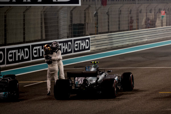 Yas Marina Circuit, Abu Dhabi, United Arab Emirates.
Sunday 26 November 2017.
Valtteri Bottas, Mercedes AMG, 1st Position, and Lewis Hamilton, Mercedes AMG, 2nd Position, celebrate.
World Copyright: Glenn Dunbar/LAT Images 
ref: Digital Image _31I9262