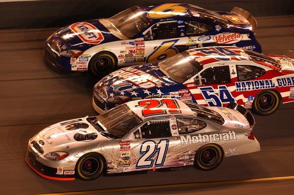 Three wide racing in a seventy lap exhibition race (Top to Bottom): Seventeenth placed Mark Martin (USA) Viagra Ford; thirteenth placed Todd Bodine (USA) Discover Card Ford; Ricky Rudd (USA) Motorcraft Quality Parts Ford who finished eighth. 
Budweiser Shootout, Daytona International Speedway, Florida, USA, 8 February 2003.
DIGITAL IMAGE
