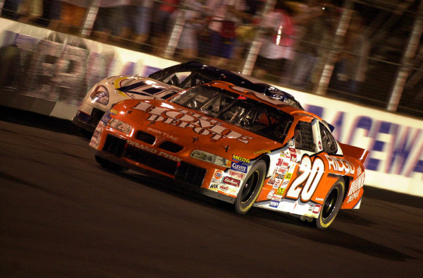 Tony Stewart (20) slips past leader Rusty Wallace to assume control of the race.
NASCAR Pontiac Excitement 400 at Richmond International Raceway Richmond, Virginia, USA 6 May,2000
-F
Peirce Williams 2000 LAT PHOTOGRAPHIC Tony Stewart (20) slips past leader Rusty Wallace to assume control of the race.
NASCAR Pontiac Excitement 400 at Richmond International Raceway Richmond, Virginia, USA 6 May,2000
-F
Peirce Williams 2000 LAT PHOTOGRAPHIC