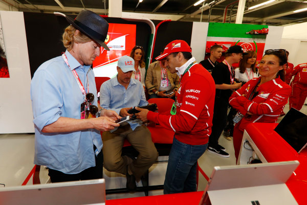 Silverstone, Northamptonshire, UK. 
Sunday 16 July 2017.
Owen Wilson and Woody Harrelson receive a tour of the Ferrari garage from Sergio Marchionne, Chief Executive Officer, Fiat Chrysler and Chairman, Ferrari. Gene.
World Copyright: Glenn Dunbar/LAT Images 
ref: Digital Image _X4I7187