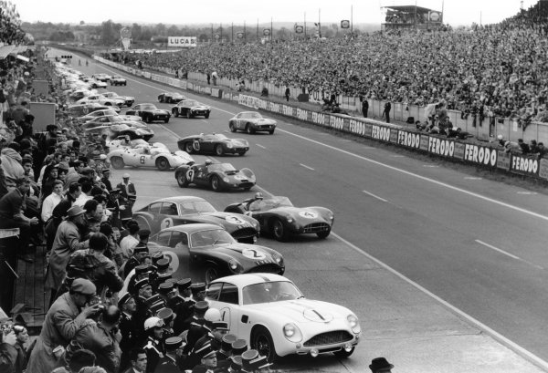 Le Mans, France. 10-11 June 1961.
The cars and drivers make the traditional LeMans start behind Jean Kerguen/Jacques Dewez (#1 Aston Martin DB4GT Zagato). Roy Salvadori/Tony Maggs (#4 Aston Martin DBR1), Ludovico Scarfiotti/Nino Vaccarella (#9 Maserati Tipo 63), eventual winner Olivier Gendebien/Phil Hill (#10 Ferrari 250TR Testa Rossa) and Lucien Bianchi/Georges Berger (#15 Ferrari 250GT SWB) are among the first away.
World Copyright: LAT Photographic
Ref: Autosport b&w print Le Mans, France. 10-11 June 1961.
The cars and drivers make the traditional LeMans start behind Jean Kerguen/Jacques Dewez (#1 Aston Martin DB4GT Zagato). Roy Salvadori/Tony Maggs (#4 Aston Martin DBR1), Ludovico Scarfiotti/Nino Vaccarella (#9 Maserati Tipo 63), eventual winner Olivier Gendebien/Phil Hill (#10 Ferrari 250TR Testa Rossa) and Lucien Bianchi/Georges Berger (#15 Ferrari 250GT SWB) are among the first away.
World Copyright: LAT Photographic
Ref: Autosport b&w print
