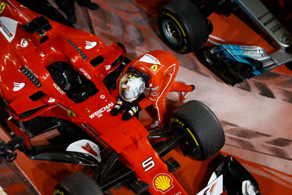 Bahrain International Circuit, Sakhir, Bahrain. 
Sunday 16 April 2017.
Sebastian Vettel, Ferrari SF70H, celebrates with his car in Parc Ferme after winning the race.
World Copyright: Steven Tee/LAT Images
ref: Digital Image _R3I0385