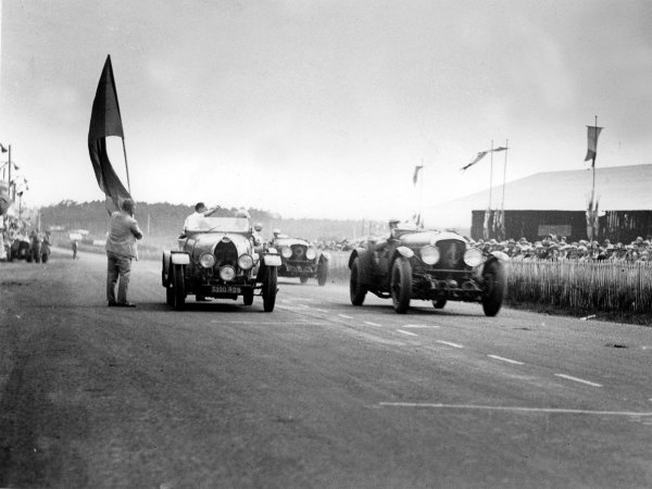Le Mans, France.
21-22 June 1930.
Woolf Barnato/Glen Kidston (number 4, Bentley Speed Six), 1st position. Mmes Marguerite Mareuse/Odette Siko (number 25, Bugatti T40), 7th position. Frank Clement/Richard Watney (Bentley Speed Six) follows in 2nd.
Ref-Autocar B4177.
World Copyright - LAT Photographic Le Mans, France.
21-22 June 1930.
Woolf Barnato/Glen Kidston (number 4, Bentley Speed Six), 1st position. Mmes Marguerite Mareuse/Odette Siko (number 25, Bugatti T40), 7th position. Frank Clement/Richard Watney (Bentley Speed Six) follows in 2nd.
Ref-Autocar B4177.
World Copyright - LAT Photographic