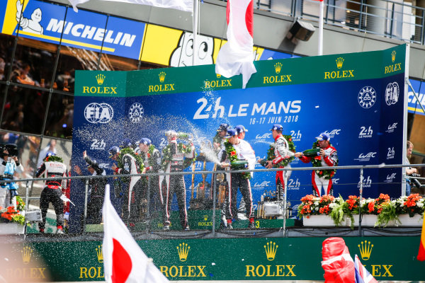 #3 Rebellion Racing Rebellion R-13: Mathias Beche, Gustavo Menezes, Thomas Laurent, finishes 3rd,  #7 Toyota Gazoo Racing Toyota TS050: Mike Conway, Kamui Kobayashi, Jose Maria Lopez, finishes and Fernando Alonso, Toyota Gazoo Racing, and Sébastien Buemi, Toyota Gazoo Racing, celebrate win Le Mans 2018