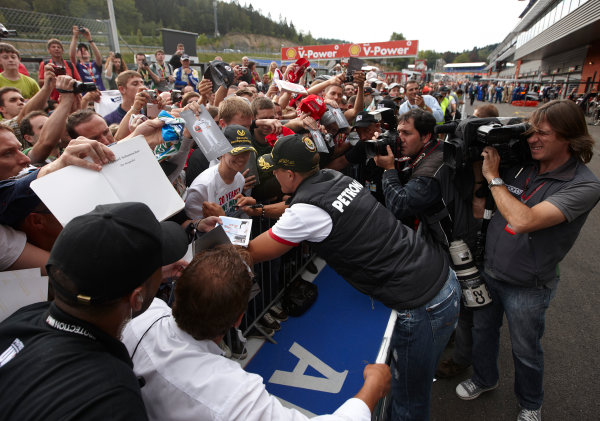 Spa-Francorchamps, Spa, Belgium
25th August 2011.
Michael Schumacher, Mercedes GP W02, signs autographs for fans. Portrait. Atmosphere. 
World Copyright: Steve Etherington/LAT Photographic
ref: Digital Image SNE26538