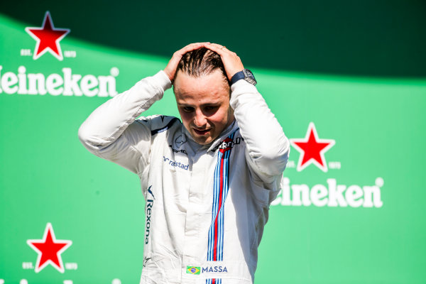 Interlagos, Sao Paulo, Brazil.
Sunday 12 November 2017.
Felipe Massa, Williams Martini Racing, waves from the podium whilst celebrating after his final home Grand Prix.
World Copyright: Charles Coates/LAT Images 
ref: Digital Image AN7T7617