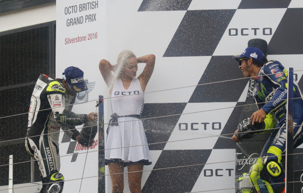 2016 MotoGP Championship. 
British Grand Prix. 
Silverstone, England. 2nd - 4th September 2016. 
Cal Crutchlow, LCR Honda, and Valentino Rossi, Yamaha, celebrate on the podium. 
Ref: _W7_9549a. World copyright: Kevin Wood/LAT Photographic