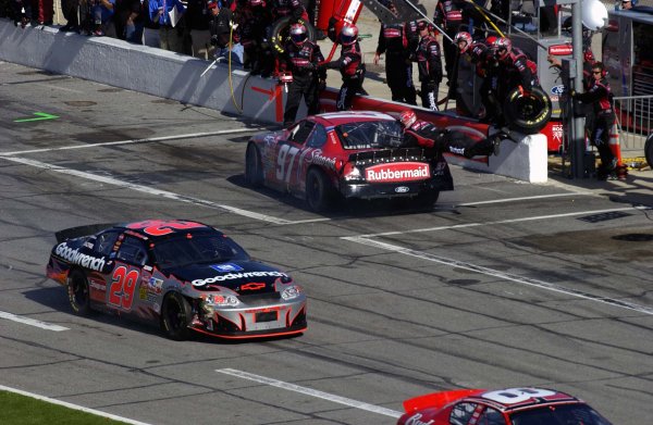 NASCAR Winston Cup Daytona 500 Practice,Qualifying & Twin 125's, Daytona International Speedway, Daytona Beach, FL, USA 8-13 February,2003
Kurt Busch (97) spins into his pit stall after pitlane contact with Kevin Harvick, hitting jack man Scott Radell. Radell was not injured in the incident.
World Copyright-F
Peirce Williams 2003 LAT Photographic
ref: Digital Image Only