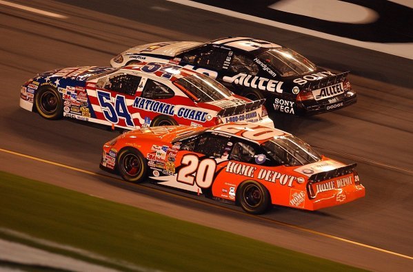 Three abreast as they approach the finish line (L to R): Fifteenth placed Tony Stewart (USA) Home Depot Pontiac; Todd Bodine (USA) Army National Guard Ford, who finished thirteenth; Ryan Newman (USA) ALLTEL Ford who finished fourth.
Budweiser Shootout, Daytona International Speedway, Florida, USA, 8 February 2003.
DIGITAL IMAGE
