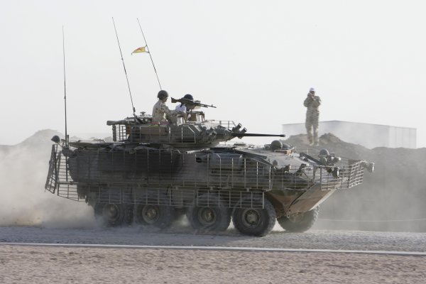 2007 Australian V8 Supercars.
Bahrain International Circuit. Sakhir, Bahrain.
2nd - 4th November.
Kelly and Greg Murphy race against Craig Lowndes and Jason Bright in a pair of armored troop carriers during a visit to the Australian troops based at Tallil Airbase located approximately 310 kilometers Southeast of Baghdad.
World Copyright: Mark Horsburgh/LAT Photographic.
Ref: Digital Image V8-Drivers-IRAQ-6979 2007 Australian V8 Supercars.
Bahrain International Circuit. Sakhir, Bahrain.
2nd - 4th November.
Kelly and Greg Murphy race against Craig Lowndes and Jason Bright in a pair of armored troop carriers during a visit to the Australian troops based at Tallil Airbase located approximately 310 kilometers Southeast of Baghdad.
World Copyright: Mark Horsburgh/LAT Photographic.
Ref: Digital Image V8-Drivers-IRAQ-6979
