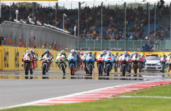 British Grand Prix. 
Silverstone, England. 30th August - 1st September 2013. 
Luis Salom, KTM, Alex Rins, KTM, and Maverick Vinales, KTM, lead off the front row at the start. 
Ref: IMG_2612a. World copyright: Kevin Wood/LAT Photographic