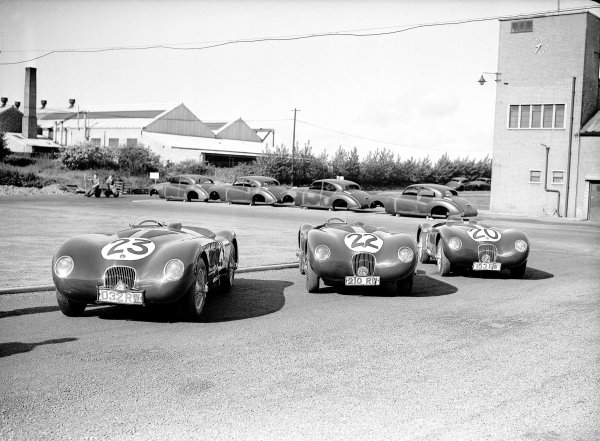 Le Mans, France. 23-24 June 1951.
The victorious Jaguar team outside the factory. The winning C-type of Peter Walker/Peter Whitehead (number 20) with sister cars of Stirling Moss/Jack Fairman (number 22) and Leslie Johnson/Clemente Biondetti (number 23).
Ref-Motor 779/53.
World Copyright - LAT Photographic Le Mans, France. 23-24 June 1951.
The victorious Jaguar team outside the factory. The winning C-type of Peter Walker/Peter Whitehead (number 20) with sister cars of Stirling Moss/Jack Fairman (number 22) and Leslie Johnson/Clemente Biondetti (number 23).
Ref-Motor 779/53.
World Copyright - LAT Photographic