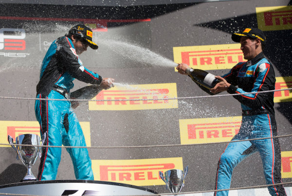 2017 GP3 Series Round 1. 
Circuit de Catalunya, Barcelona, Spain.
Sunday 14 May 2017.
Winner of Race Two Arjun Maini (IND, Jenzer Motorsport) ,and third placed Alessio Lorandi (ITA, Jenzer Motorsport) on the podium with the champagne
Photo: Jed Leicester/GP3 Series Media Service.
ref: Digital Image JL1_0170