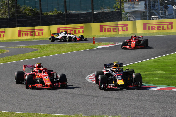 Kimi Raikkonen, Ferrari SF71H and Max Verstappen, Red Bull Racing RB14 battle