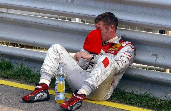 2004 DTM Championship
Zandvoort, Netherlands. 4th - 5th September.
Tom Kristensen (Abt Sportsline Audi A4) waits to hear news of Peter Dumbreck's condition after his huge accident. Portrait.
World Copyright: Andre Irlmeier/LAT Photographic
ref: Digital Image Only